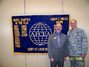 Col. Piontkowsky (r) thanks guest speaker Irvin Varkonyi, marketing manager for transportation and logistics programs, American Public University System, for his presentation at the January event.